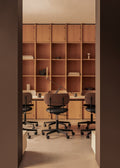 Audo Copenhagen Co Task Chair, Upholstered Seat, Without Arms, upholstered Co Task Chairs at a Co Table with an Interconnect Candleholder against a wall of wooden shelving
