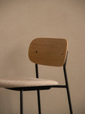 Audo Copenhagen Co Bar Chair, Upholstered, the Co Bar Chair, Upholstered, showing the light wood veneer backrest and textured fabric seat on a black frame