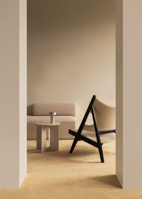 Knitting Lounge Chair styled in a modern living room with Eave Modular Sofa and Androgyne Side Table by Audo Copenhagen.