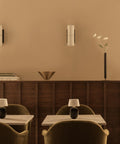 torso table lamp portable in a restaurant designed by Kroeyer-Saetter-Lassen for audo copenhagen