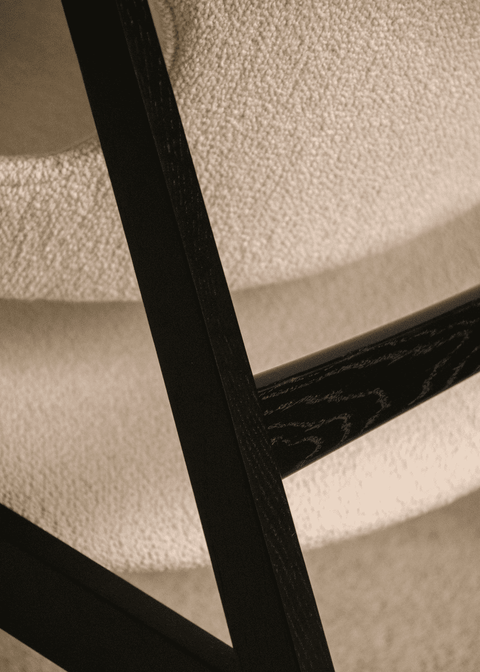 Detailed view of Knitting Lounge Chair upholstery and frame craftsmanship by Audo Copenhagen.