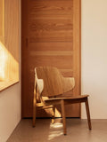 Audo Copenhagen The Penguin Wooden Lounge Chair in a styled interior