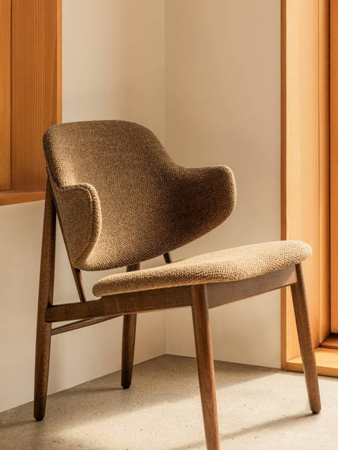 Audo Copenhagen The Penguin Wooden Lounge Chair, Upholstered in a styled interior