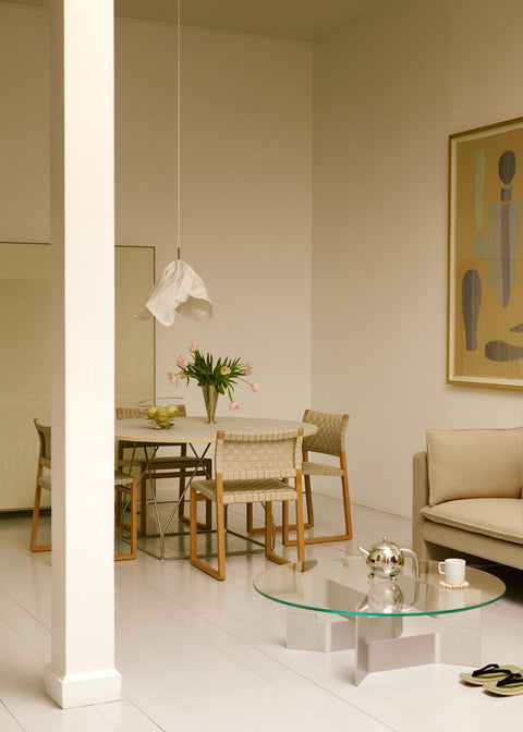 JG Coffee Table in light Danish interior round glass top with brushed aluminum base