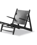 black oak frame and black saddle leather hunting chair by borge mogensen for fredericia furniture