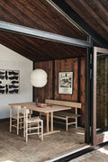 Dining scene with J39 paper cord chairs and Mogensen 3171 oak bench, Scandinavian wood interior