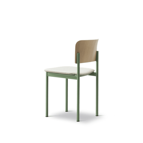 Side profile of PLAN Chair by Fredericia with upholstered seat and green steel legs, highlighting its minimalist design