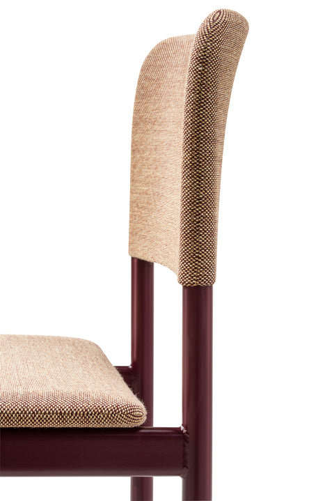 Close-up of Fredericia Plan Chair upholstered in Steelcut Quartet 554 with Bordeaux lacquered steel frame