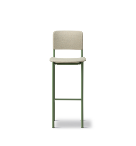 PLAN Barstool fully upholstered in light fabric with slim green metal legs and footrest.