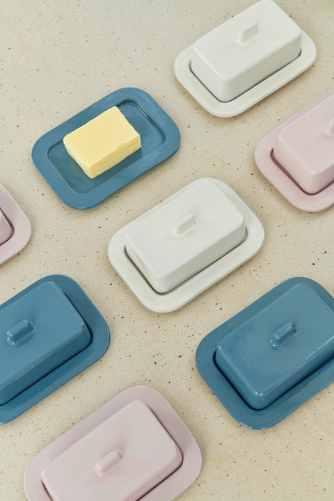 HAY Barro Butter Dish, Off-White, glazed terracotta butter dishes, overhead group in blue, pink and cream with a pat of butter