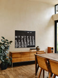 2026 Stendig Calendar in a dining room setting with wood furniture and natural light