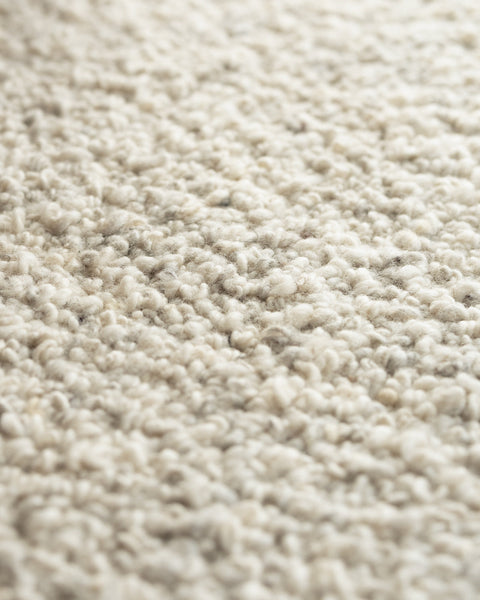 white boucle area rug by Mark Krebs