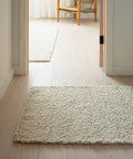 white boucle runner on oak floors