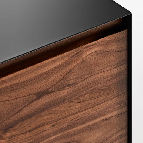 Blu Dot Clad 2 Door Credenza in Walnut/Oblivion detail shot showing solid walnut door grain against black steel case
