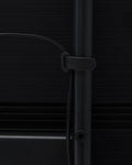 Pedestal Cable Tie in Charcoal, soft silicone cable tie, holding a cable against the leg of a Charcoal TV stand