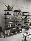 black minimalist free standing shelving unit by muuto 