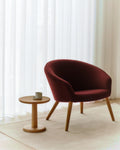 danish modern lounge chair with red upholstery and oak legs by Fredericia Furniture 