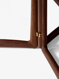 Detail of &Tradition HM5 Drop Leaf Table in oiled walnut – brass hinge and solid wood craftsmanship by Hvidt & Mølgaard