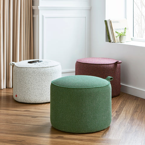 Three Gus Modern Drummond Poufs in Jubilee Dalmatian, Jubilee Sangria, and Jasper Evergreen arranged in a living room setting