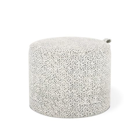 Gus Modern Drummond Pouf in Jubilee Dalmatian fabric with black speckled texture and integrated handle"
