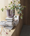 Contemporary design Muuto Kink Vase with decorative flowers in cozy setting