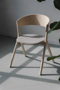 Modern Circus Chair by EDITS, Canadian furniture brand, natural wood with grey upholstered seat.