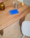 Muuto Re Norm Table 130 in walnut veneer by Maria Bruun close up of tabletop and sculptural legs