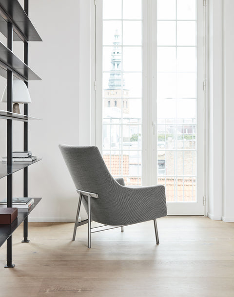 Jens Risom A Chair lounge in light grey fabric on brushed steel base by Fredericia in a bright Scandinavian interior