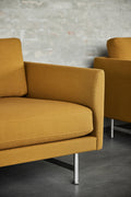 scandinavian sofa with mustard yellow fabric and chrome metal legs by fredericia furniture 