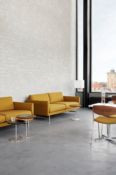 calmo sofa with pal end table in scandinavian inspired office space by fredericia furniture 