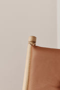 Fredericia 1788 chair styled with soft lighting and wooden accents