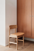 Mogensen 3236 chair by Fredericia styled in a modern Scandinavian dining room in Canada