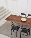 post dining table in smoked oak and post dining chairs in lacquered black oak by cecile manz for fredericia furniture