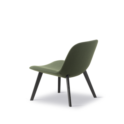 Rear three quarter view Fredericia Eyes Lounge Chair green upholstery on black oak legs Scandinavian lounge chair