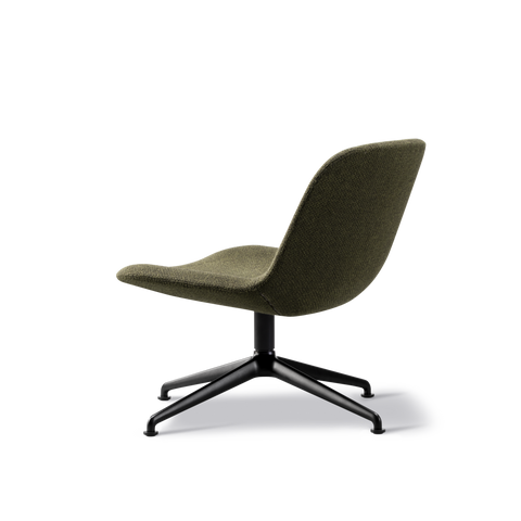 Side profile of low lounge chair in textured green upholstery with ergonomic seat and black four star swivel base, contemporary Scandinavian