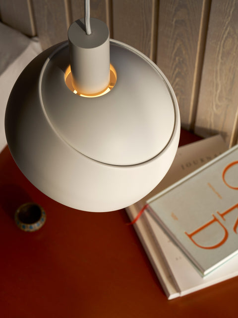 Close up of Finn Juhl Elements pendant lamp in white by Louis Poulsen detail of shade and soft glow modern Scandinavian lighting Canada