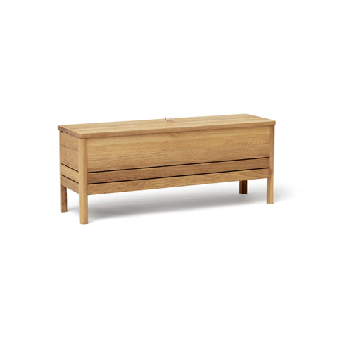 Form & Refine A Line Storage Bench 111, Oak, oak storage bench with lid, three-quarter view on white background