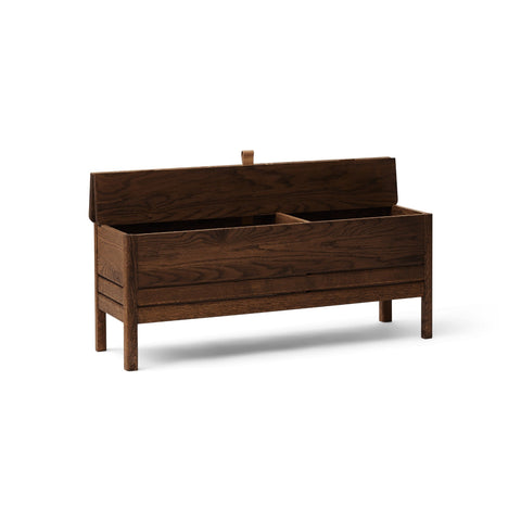 Form & Refine A Line Storage Bench 111, Smoked Oak, oak storage bench with lid, three-quarter view on white background