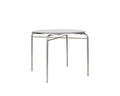 Frama Petit Rond Table, wide round steel top on splayed tubular legs with cross stretchers, seen straight on against white