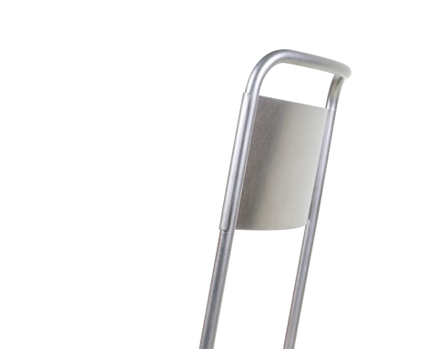 Frama Petit Rond Chair in Stainless Steel, close crop of the tubular back loop and the curved steel panel set between it
