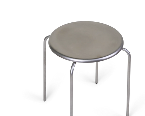 Frama Petit Rond Stool in Stainless Steel, low angle close view of the round steel seat and the bent tube legs