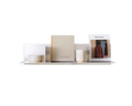 Frama Rivet Shelf, metal wall shelf lined with books, a candle, a small pot and a standing magazine against a white background