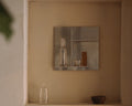 Frama Rivet Typecase in Aluminum, metal box set in a plaster wall niche holding a bottle and a small box, bowl on the ledge