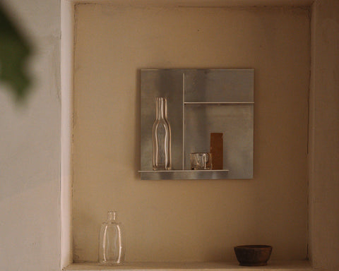 Frama Rivet Typecase in Aluminum, metal box set in a plaster wall niche holding a bottle and a small box, bowl on the ledge