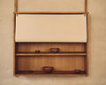 Frama Shelf Library Canvas Cabinet Section in Natural Oak, canvas front rolled up to show two oak shelves holding small turned wooden bowls