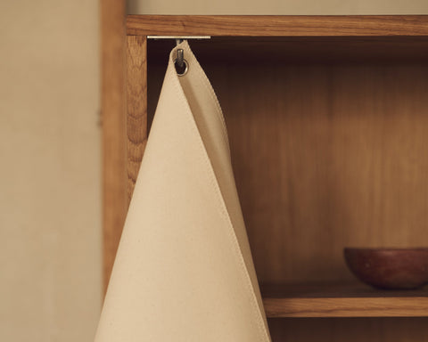 Frama Shelf Library Canvas Cabinet in Natural Oak and Canvas, close up of the canvas front lifted on a hook to show the oak interior shelf