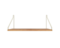 Frama Single Shelf, Natural Oak in Brass, deep oak board with brass brackets rising to the wall, front view on pale grey