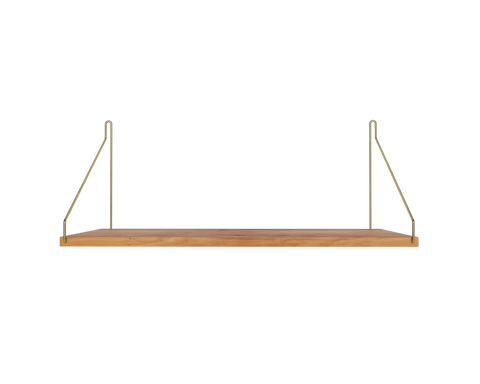 Frama Single Shelf, Natural Oak in Brass, deep oak board with brass brackets rising to the wall, front view on pale grey