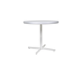Frama Tasca Table, wide round aluminum top on a central column and four armed foot, three quarter view on pale grey