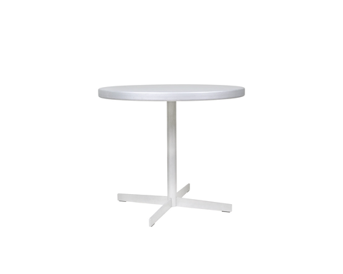 Frama Tasca Table, wide round aluminum top on a central column and four armed foot, three quarter view on pale grey